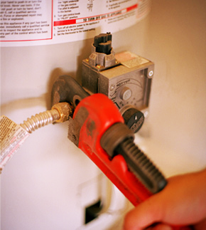 Coppell plumber repairs a water heater