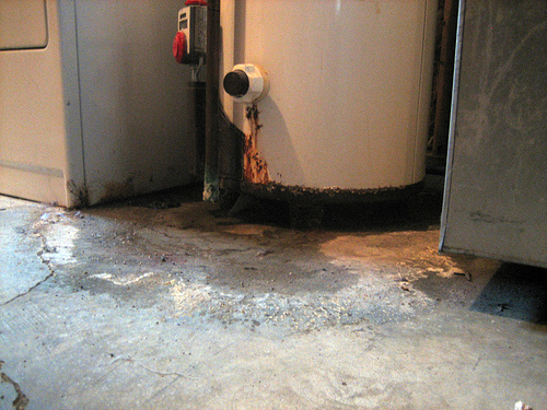 corroded floor - good time for a water heater repair in Coppell TX